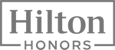 The image shows the logo of Hilton Honors, the loyalty program by Hilton hotels, with 